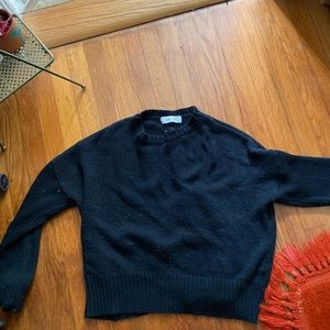 Black sweater cross cross on back